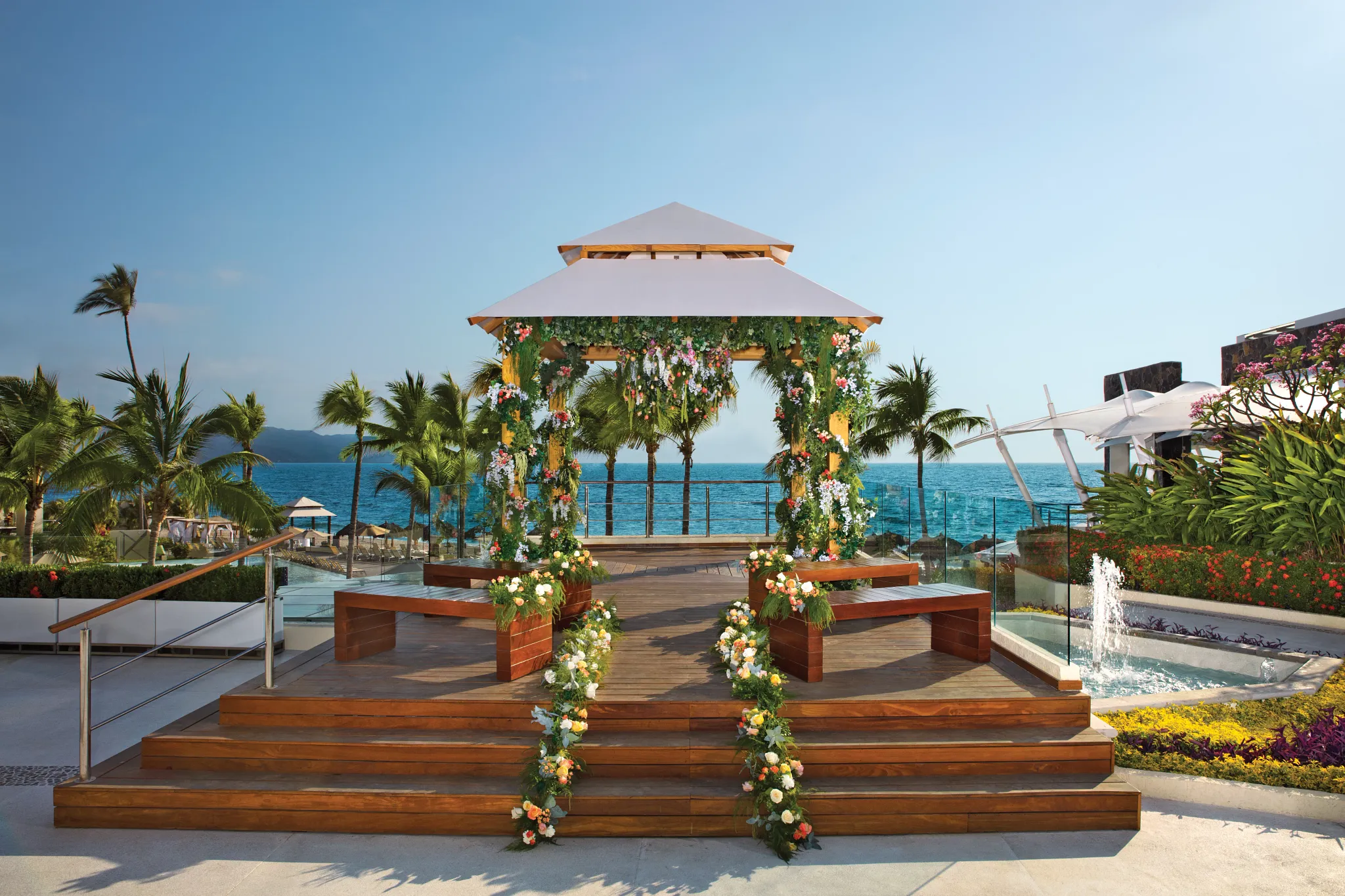 Oceanfront wedding gazebo ceremony setup at Dreams Vallarta Bay Resort & Spa