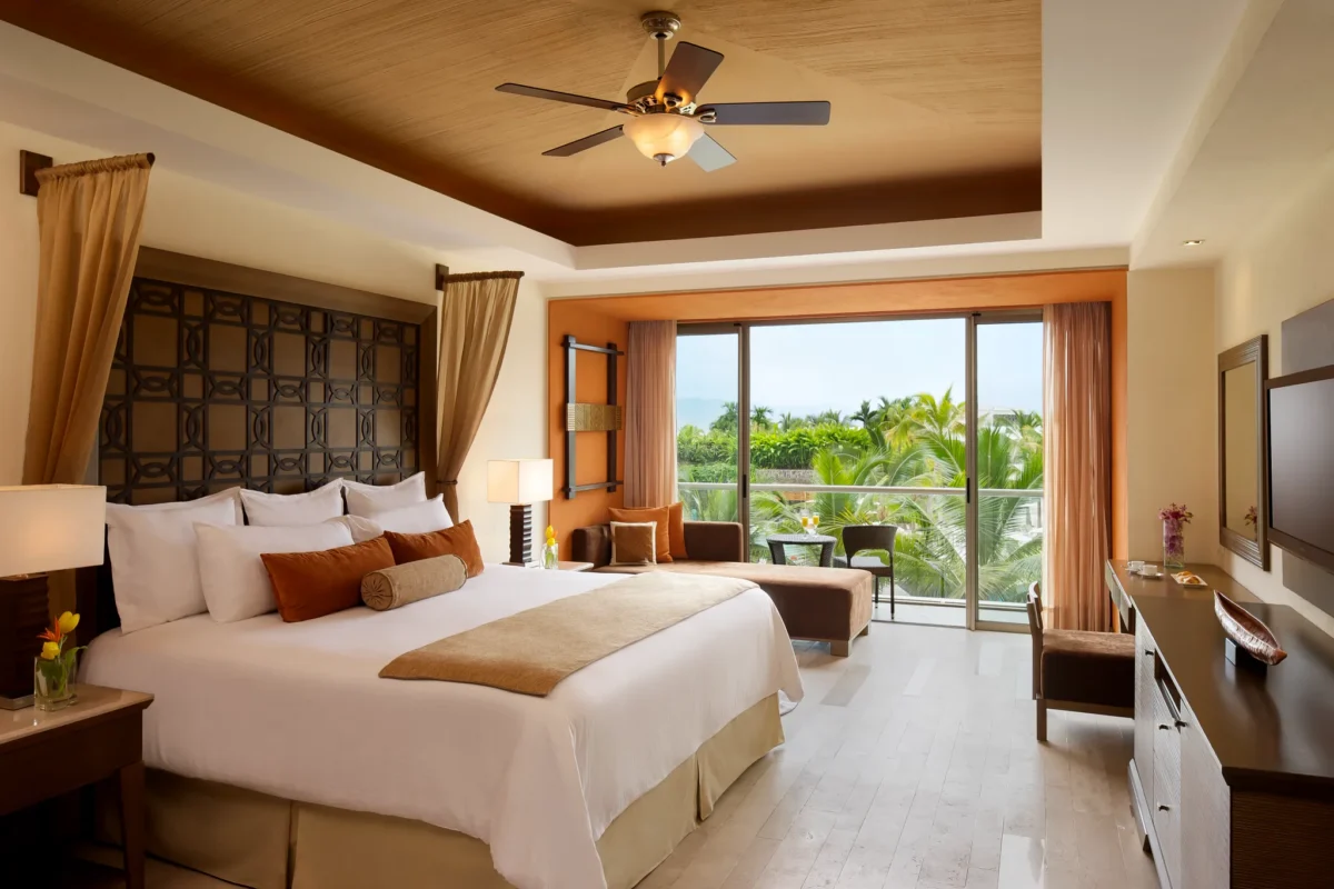 Junior Suite Garden View King with private balcony at Dreams Vallarta Bay Resort & Spa.