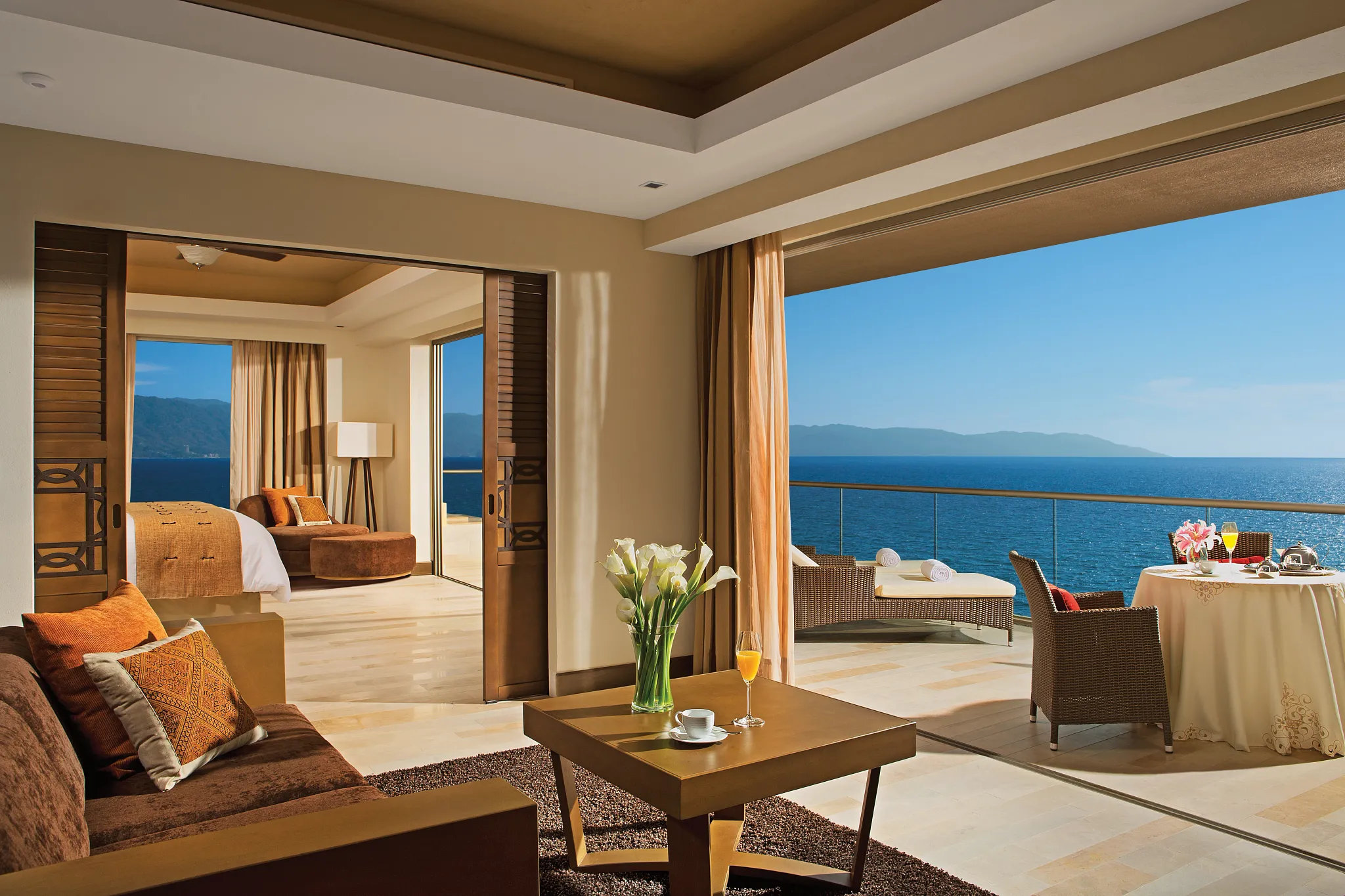 Preferred Club Master Suite Oceanfront Swim Out living room with terrace and ocean views at Dreams Vallarta Bay Resort & Spa.