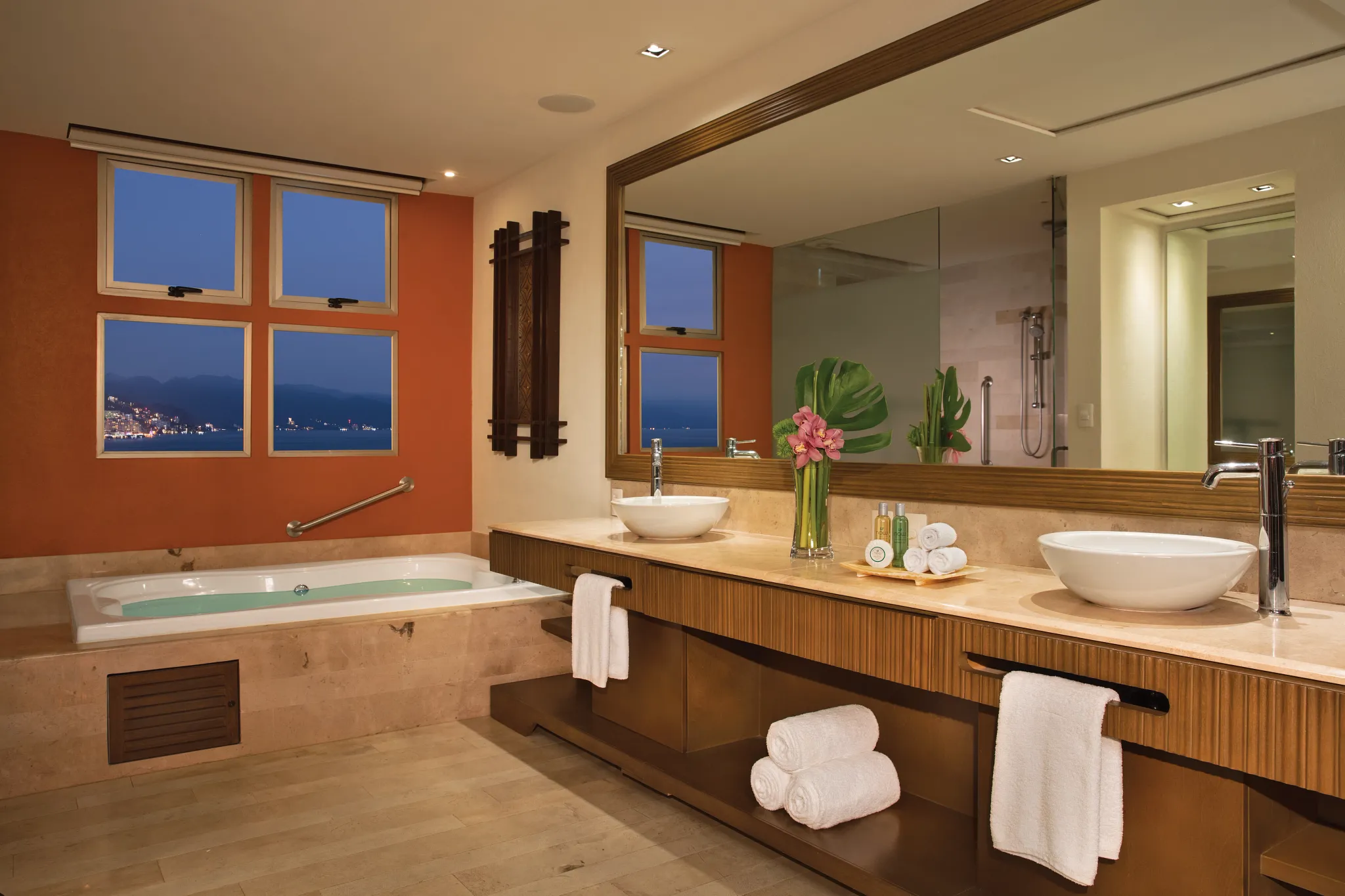 Preferred Club Master Suite Swim Out bathroom with double vanity and hot tub at Dreams Vallarta Bay Resort & Spa.