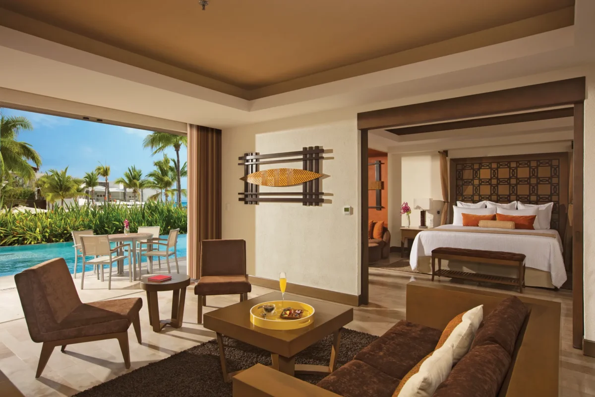 Preferred Club Master Suite Tropical View Swim Out living room and terrace with pool access at Dreams Vallarta Bay Resort & Spa.